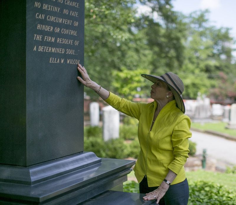 Valerie Jackson at her husband’s gravesite Friday with the new monument she had built to honor he husband, Maynard Jackson. BOB ANDRES /BANDRES@AJC.COM