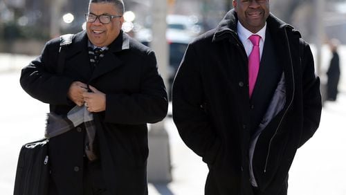 Jerry Clark, right, former DeKalb Zoning Board of Appeals member, and his attorney Gary Spencer walked to federal court on Feb. 19, 2015 before Clark pleaded guilty. BEN GRAY / BGRAY@AJC.COM
