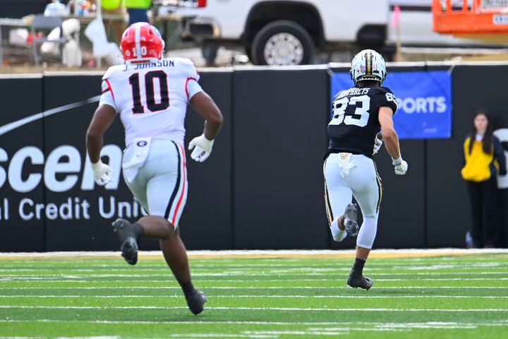 Vanderbilt wide receiver London Humphreys (83) runs for a touchdown as Georgia linebacker Jamon Dumas-Johnson (10) chases during the first quarter of an NCAA football game, Saturday, Oct. 14, 2023, in Nashville, Tenn. (Special to the AJC/John Amis)