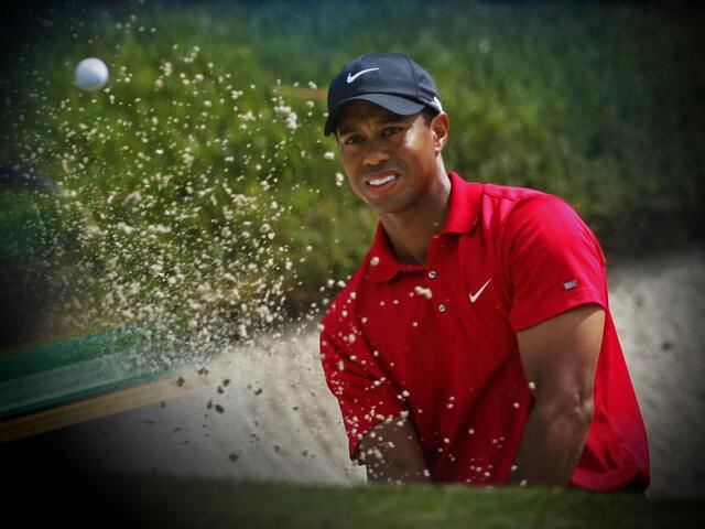 Tiger Woods hits out of a bunker on the eighth green during a playoff round at the US Open, Torrey Pines Golf, San Diego, California in June 2008.