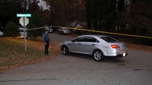 Crime scene tape blocks the entrance to Barnaby Court from Candlewick Lane, where Gwinnett County police were investigating a homicide Friday morning.