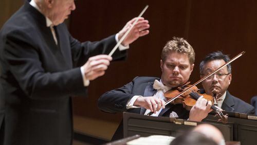 Conductor Edo de Waart conducts concertmaster David Coucheron and the ASO in “Ein Heldenleben.”