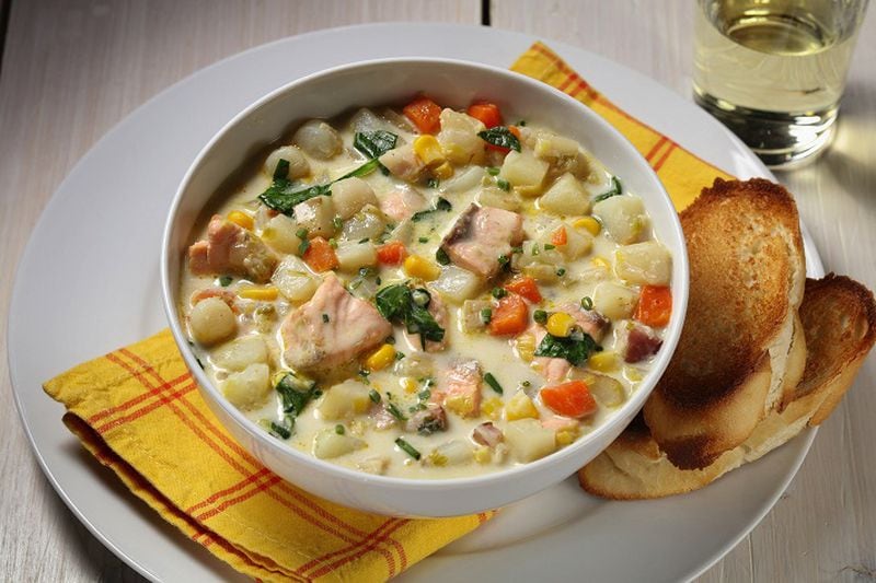 Salmon and bay scallops stud a chowder made with leek, bacon, potatoes, corn, carrot and spinach. (Abel Uribe/Chicago Tribune/TNS)