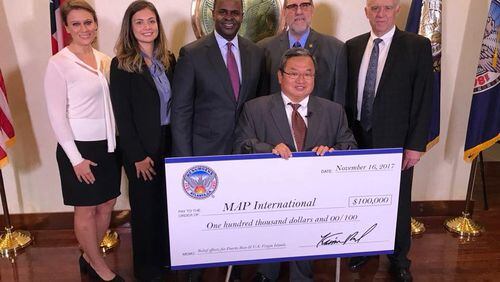 Mayor Kasim Reed donates $100,000 on behalf of the City of Atlanta to MAP International for Hurricane Maria relief efforts. CONTRIBUTED