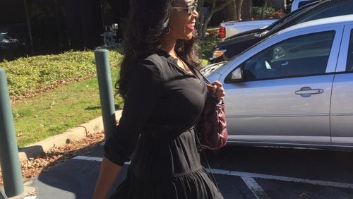 Kenya Moore briskly walks by the media this morning outside Sandy Springs municipal court. (The media really was just me and WSB-TV.) CREDIT: Rodney Ho/ rho@ajc.com