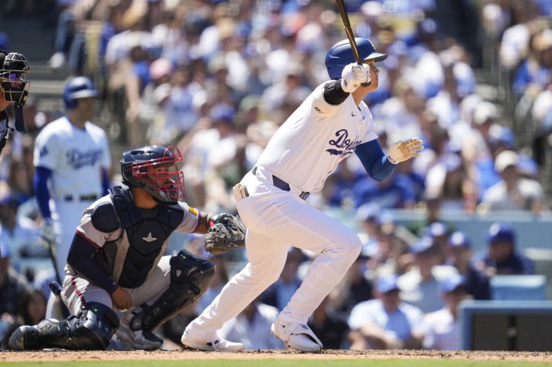Los Angeles Dodgers designated hitter Shohei Ohtani (17) singles during the sixth inning of a baseball game against the Atlanta Braves in Los Angeles, Sunday, May 5, 2024. (AP Photo/Ashley Landis)