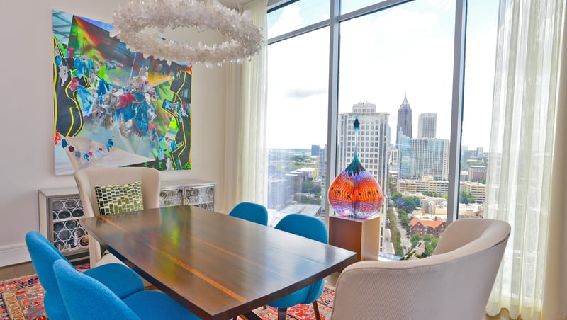 Wells hired designer Suzanne Williams to create a soft contemporary interior style in his Midtown condo. He brought much of the furniture from his old Buckhead home to his new high-rise condo, along with his large collection of paintings, photography and sculptures. Williams advised him on his furniture selection and lighting, as well as how best to display his artwork.