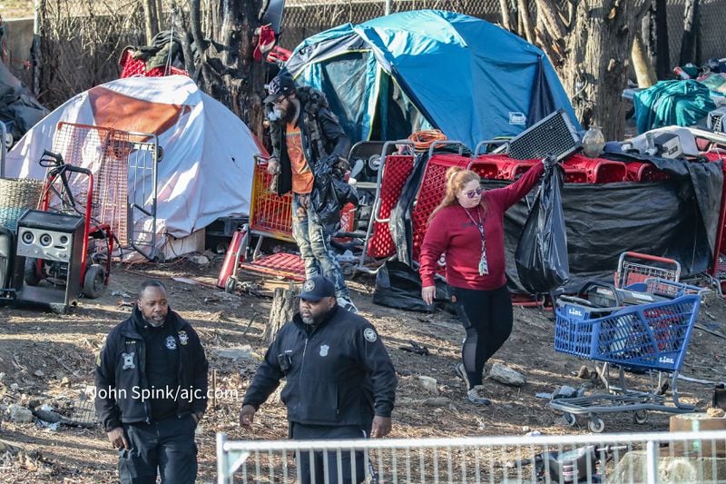 Atlanta Police and state of Georgia personnel clear a homeless encampment in February.