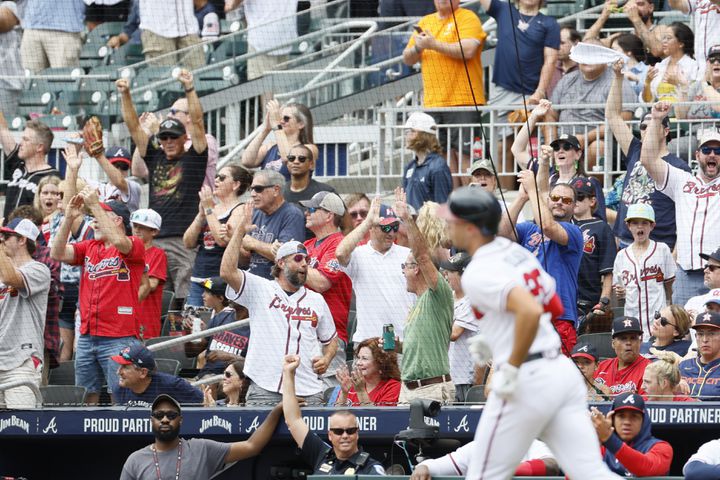 The crowd cheers after Braves first baseman Matt Olson homered during the first inning against the Astros on Sunday at Truist Park. (Miguel Martinez / miguel.martinezjimenez@ajc.com)