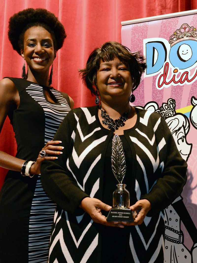 Rachel Renee Russell, author of "Dork Diaries" with daughter and series illustrator Nikki Russell (L) pictured in Atlanta accepting the 2014 Milner Award for Children's Literature.