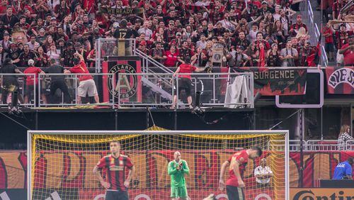 Atlanta United fans cheer in the stands as players warm up before a Major League Soccer game between the Atlanta United and Montreal Impact at the Mercedes-Benz Stadium , Sunday, Sept. 24, 2017, in Atlanta.  BRANDEN CAMP/SPECIAL