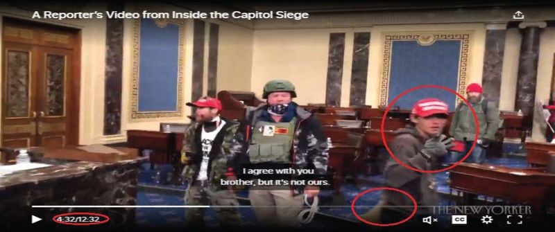 The FBI's criminal complaint against 18-year-old Bruno Cua of Milton includes this screen capture of a video published by The New Yorker magazine, which shows the moments that the U.S. Senate chamber was breached on Jan. 6. The FBI identifies Cua with a red circle.