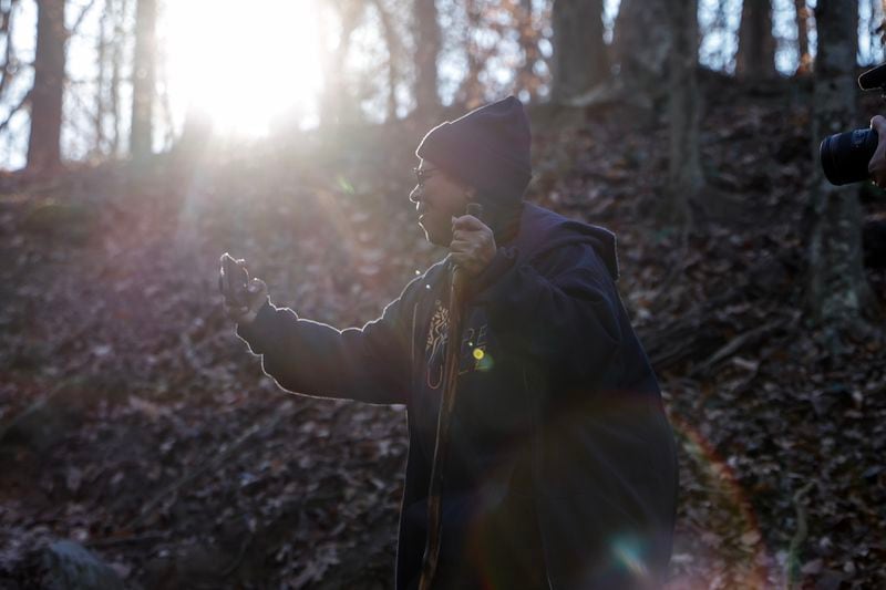 Photographer Sue Ross takes a photo while walking at Cascade Springs Nature Preserve Trail on Friday, Feb. 2, 2024. (Natrice Miller/ Natrice.miller@ajc.com)