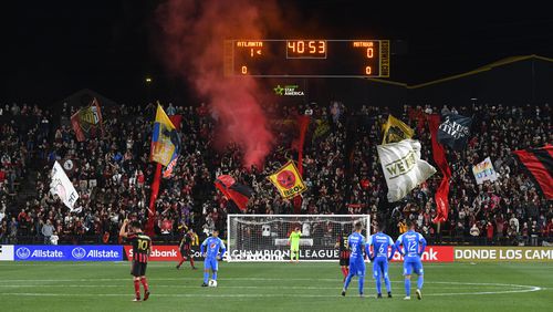 Fans celebrate and the scoreboard reflects the score going into half time during the first half of soccer in the Scotiabank Concacaf Champions League against Motagua FC, Tuesday, Feb. 25, 2020, in Kennesaw, Ga. (John Amis, Atlanta Journal Constitution)