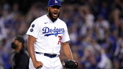 Los Angeles Dodgers pitcher Kenley Jansen reacts after getting the final out in the ninth inning against the Atlanta Braves in Game 3 of baseball's National League Championship Series Tuesday, Oct. 19, 2021, in Los Angeles. The Dodgers defeated the Braves 6-5. The Braves lead the series 2-1 games. (AP Photo/Jae Hong)