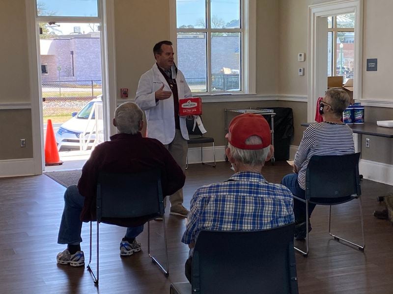 Hugh Chancy, owner of Chancy Drugs of Hahira, speaks to locals at a community center about the COVID-19 vaccine and spends time answering their questions. “When somebody tells me no, I say, ‘I understand, but tell me why,’” Chancy said. (Courtesy of Hugh Chancy)