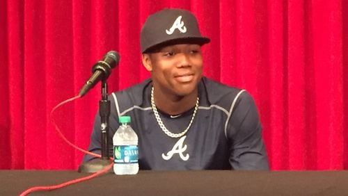 Ronald Acuna meets with the media before his major league debut on April 25 at Great American Ball Park in Cincinnati. (Gabe Burns / AJC)