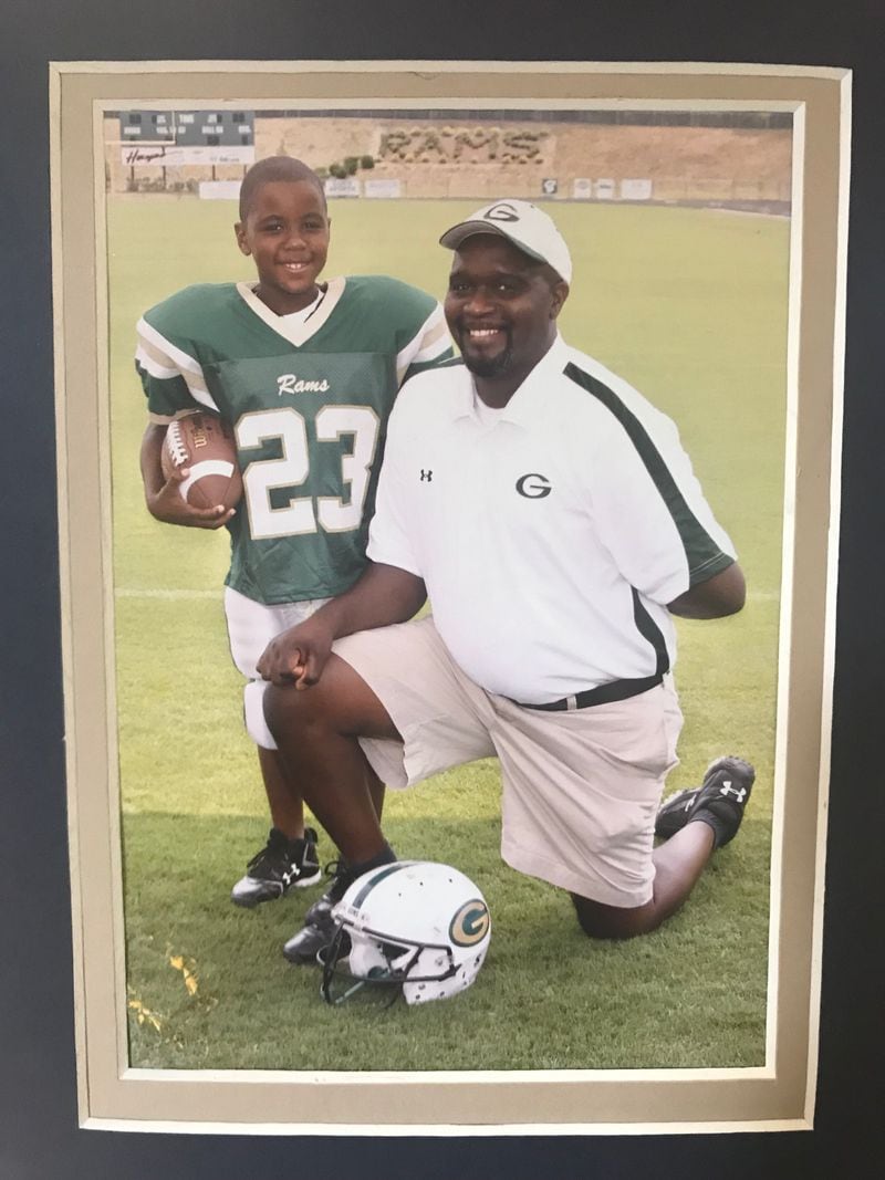 A photo of Georgia Tech freshman safety Jeremiah Smith and his father Rudy, from Smith's 7-year-old team with the Grayson Rams youth team. Kenyatta Watson Sr., the father of a Grayson teammate of Smith's and that youth team's offensive coordinator, said that Smith was the team's "bellcow" and that "I tried to run him until his tongue fell out. (Photo courtesy Rudy Smith)