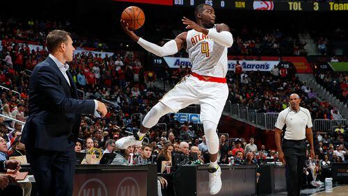 Paul Millsap of the Hawks leaps to save a ball from going out of bounds against the Bulls at Philips Arena on November 9, 2016 in Atlanta, Georgia. (Photo by Kevin C. Cox/Getty Images)