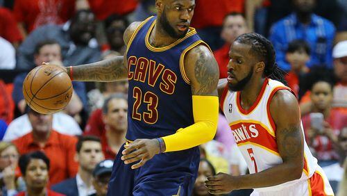 DeMarre Carroll, here defending LeBron James, returned from a sprained knee but it wasn't enough to help the Hawks in Game 2 of the Eastern Conference finals. (Curtis Compton/ccompton@ajc.com)