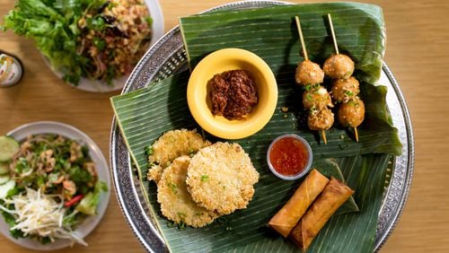 Snackboxe Bistro appetizer plate with Egg Rolls, Khao Chee, and Meatballs. Photo credit- Mia Yakel.