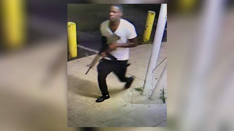 Authorities have released surveillance photos of a person of interest in the July 4 shooting death of 8-year-old Secoriea Turner.