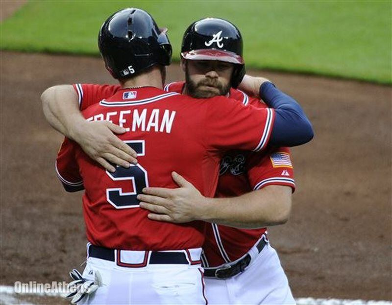 The Braves' Evan Gattis (right) homered Friday for the sixth time during his 13-game hitting streak, while the Braves are still waiting for Freddie Freeman to snap out of an uncharacteristic slump. (AP photo)