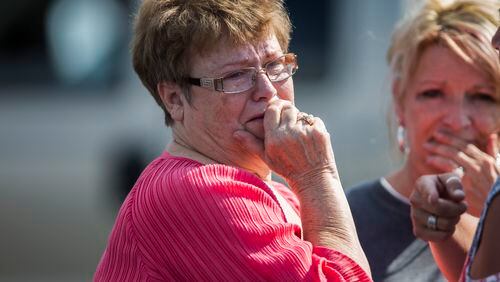 A woman reacts following a shooting at Townville Elementary in Townville Wednesday, Sept. 28, 2016. A teenager killed his father at his home Wednesday before going to the nearby elementary school and opening fire with a handgun, wounding two students and a teacher, authorities said. (Katie McLean/The Independent-Mail via AP)