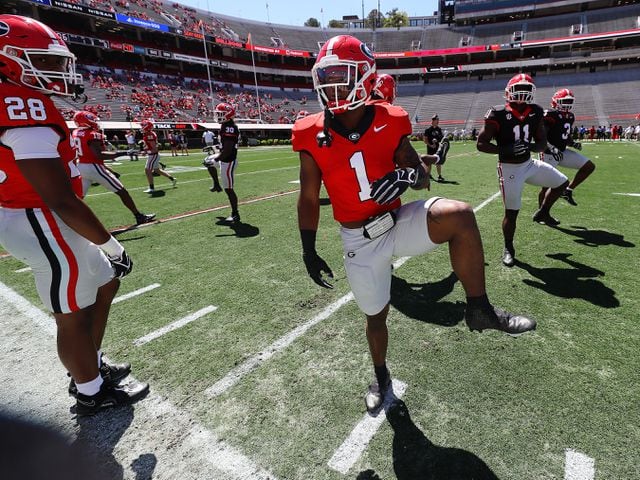 Georgia running back Trevor Etienne loosens up before playing in the G-Day game on Saturday, April 13, 2024.  Curtis Compton for the Atlanta Journal Constitution