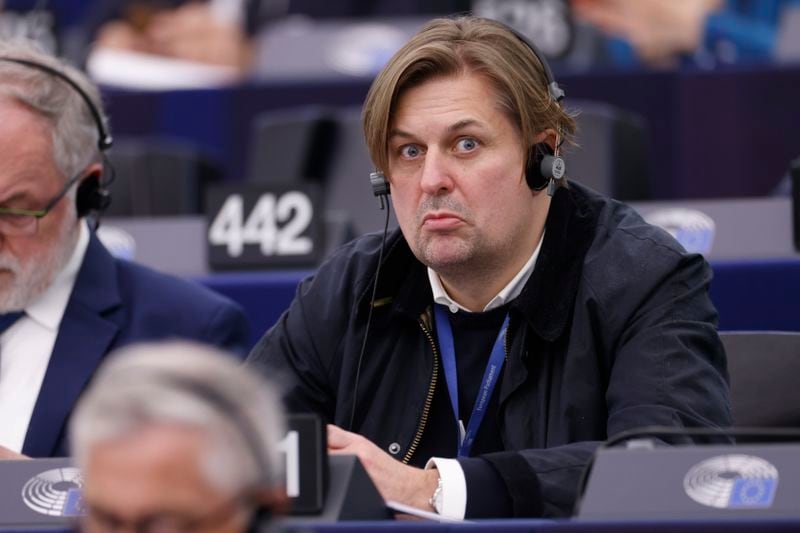 Germany's Maximilian Krah, of the far-right Alternative, grimaces during a session at the European Parliament, Tuesday, April 23, 2024 in Strasbourg, eastern France. A man who works for the prominent German far-right lawmaker in the European Parliament has been arrested on suspicion of spying for China, authorities said Tuesday. (AP Photo/Jean-Francois Badias)