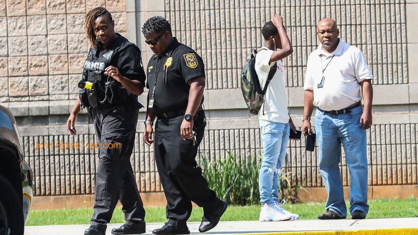 DeKalb County police were assisting DeKalb County School District police at Stephenson High School on Tuesday morning after a student reported seeing a classmate with a gun. JOHN SPINK / JSPINK@AJC.COM