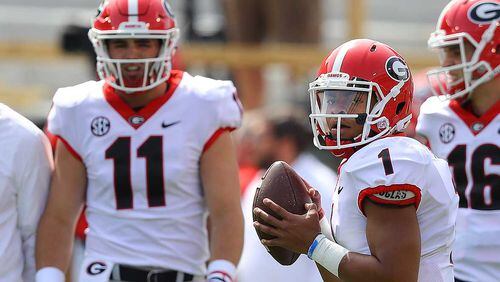 Quarterbacks Jake Fromm (11) and Justin Fields (1) prepare for Saturday's G-Day game at Sanford Stadium in Athens. (Curtis Compton/ccompton@ajc.com)