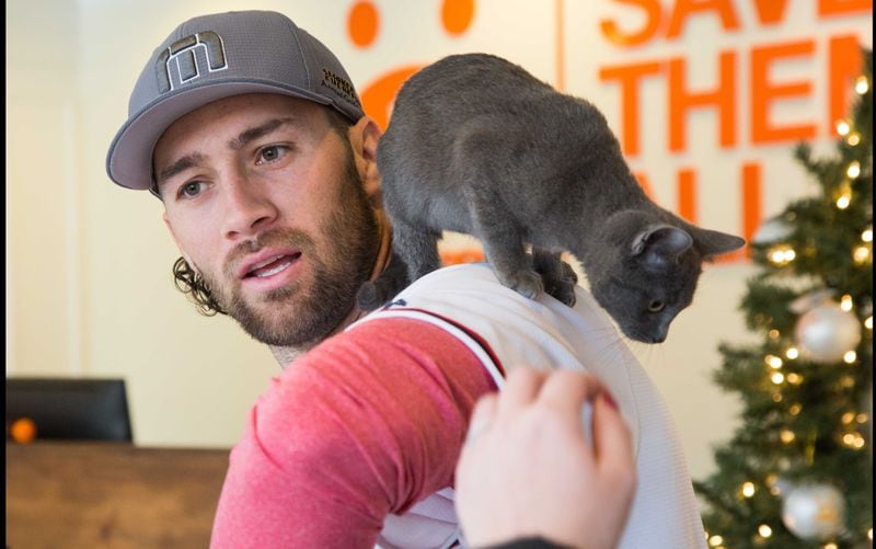 The Atlanta Braves baseball player Charlie Culberson played with a kitten as he visited Best Friends in Atlanta as part of the team's Season of Giving on Wednesday, Dec. 12, 2018. The animal shelter works collaboratively with area shelters, animal welfare organizations and individuals to save the lives of pets in shelters in the South. (Photo by Phil Skinner)