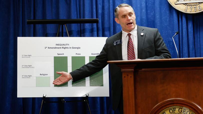 State Sen. Ed Setzler, R-Acworth, points to a chart about religious freedoms in Georgia during a press conference where he promoted a bill seeking greater legal protections for religious Georgia residents. Opponents say the legislation could be used to justify discrimination. (Natrice Miller/ natrice.miller@ajc.com)