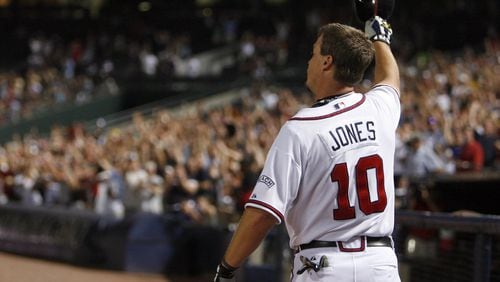 Retired Braves third baseman Chipper Jones, here tipping his cap to the crowd after hitting the 400th home run of his career in 2008, will return to the team as a special assistant to baseball operations. (Jason Getz / AJC )