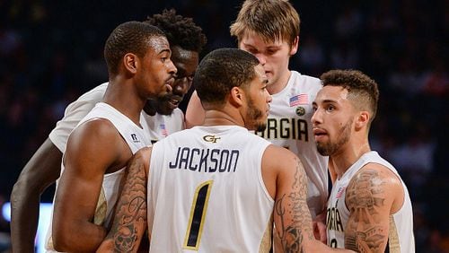 Georgia Tech senior center Ben Lammers,  center, chats with teammates Tadric Jackson, Jose Alvarado, right, and Curtis Haywood II, left, during a break in the action during Sunday night’s 77-70 loss to Tennessee in McCamish Pavilion.