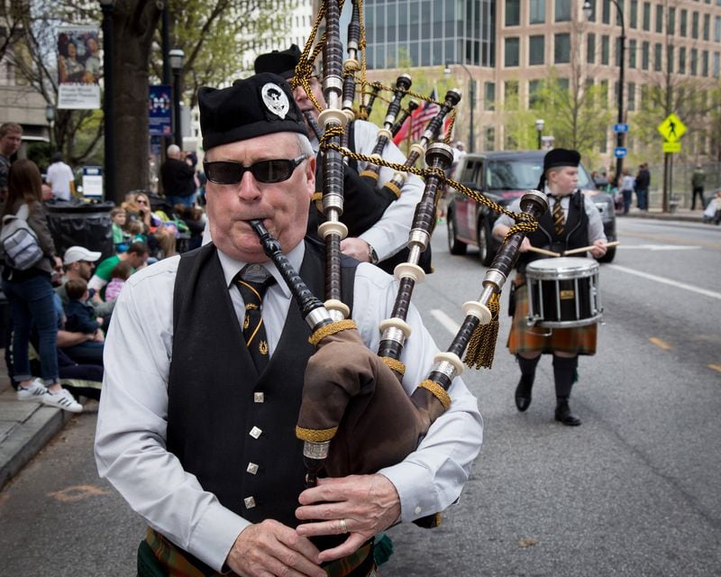 A Scottish bagpipe band makes its way up Peachtree Street during the St. Patrick’s Parade in Atlanta on Saturday, March 11, 2016. STEVE SCHAEFER / SPECIAL TO THE AJC
