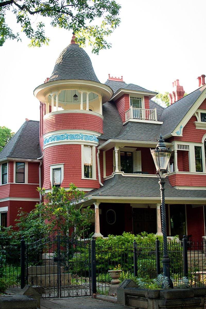 Many of the colorful houses have large porches and turrets. 
Courtesy of Food Tours Atlanta. Photographer Betsy McPherson.