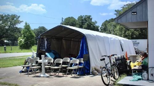 Two structures at 1803 G Street meant to cover cars act as temporary housing for people experiencing homelessness. The homeless encampment popped up after The Well, a day shelter, temporarily closed in April. (Photo Courtesy of Kailey Cota/The Current GA)