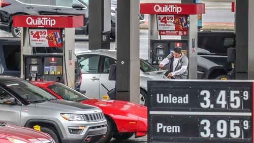 Motorists fuel up at the QuikTrip located at Spring Road and Cumberland Boulevard in Cobb County on Friday.  Gasoline prices have climbed in metro Atlanta and around the nation. Russia’s invasion of Ukraine this week sparked predictions of still higher prices.  (John Spink / John.Spink@ajc.com)