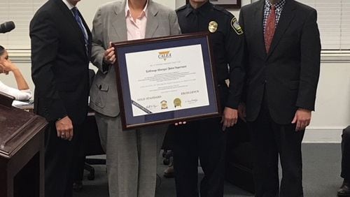 Pictured from left to right: CALEA Board Member Chief Bart Connelly, Accreditation Manager Sgt. Karen Sanders, LaGrange Police Chief Lou Dekmar, and Mayor Jim Thornton during the presentation of CALEA accreditation. CONTRIBUTED