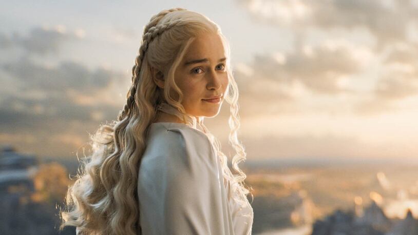 In this image released by HBO, Emilia Clarke appears in a scene from “Game of Thrones.” The 28-year-old Clarke, who plays menacing, white-haired Daenerys Targaryen, aka Khaleesi, aka Mother of Dragons on “Game of Thrones,” is Esquire’s Sexiest Woman Alive. The magazine made the announcement early Tuesday, Oct. 13. (HBO via AP)
