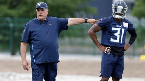 Tennessee Titans defensive coordinator Dean Pees instructs players, including free safety Kevin Byard (31), during an organized team activity at the Titans' NFL football training facility Wednesday, June 12, 2019, in Nashville, Tenn. (AP Photo/Mark Humphrey)