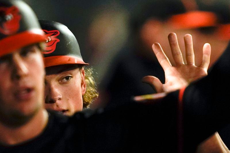 Baltimore Orioles' Jackson Holliday celebrates scoring off a double hit by Ryan O'Hearn during the fifth inning of a baseball game against the Los Angeles Angels, Tuesday, April 23, 2024, in Anaheim, Calif. (AP Photo/Ryan Sun)