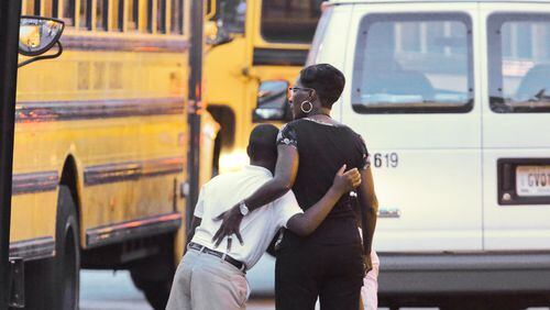 DeKalb County: Teachers and students reunited with hugs in 2013 after a gunman slipped into the building and terrorized the DeKalb County school. No one was injured in the incident, but the 20-year-old suspect, Michael Brandon Hill, shot at police. He was eventually taken into custody without incident. JOHN SPINK/JSPINK@AJC.COM