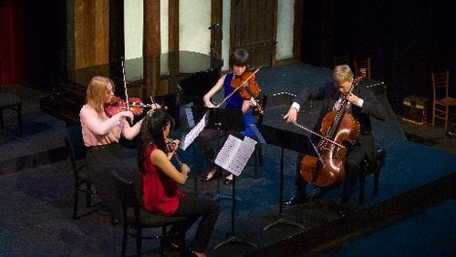 Atlanta Chamber Players musicians Anastasia Agapova (from left), Helen Kim, Catherine Lynn and Brad Ritchie perform Philip Glass' String Quartet No.5 at the New American Shakespeare Tavern in May 2015. CONTRIBUTED BY JAMES BARKER