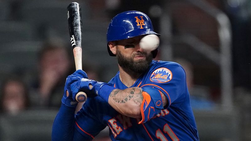 Kevin Pillar is hit in the face with a pitch from Braves reliever Jacob Webb in the seventh inning of Monday's Braves-Mets game at Truist Park.