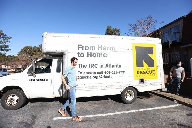 Logistic specialists Clay Hartzog and Jonathon Howard arrive at another location furnish a second apartment that will be ready the same day for the arrival of another Afghan refugee family on Wednesday, December 1, 2021. Miguel Martinez for The Atlanta Journal-Constitution 