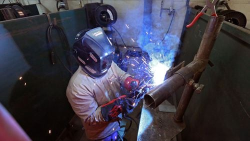 Nov. 13, 2015 - A Lanier Charter Career Academy student works on a MIG welding assignment in a class at nearby Lanier Technical College. BOB ANDRES / BANDRES@AJC.COM