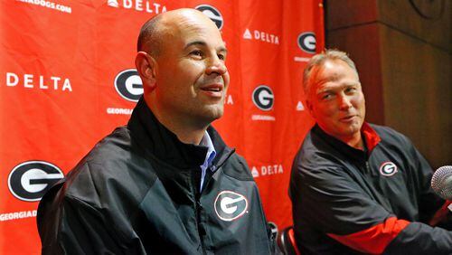 011514 ATHENS: New UGA defensive coordinator Jeremy Pruitt takes a question during his press conference with head coach Mark Richt looking on in amusement on Wednesday, Jan. 15, 2014, in Athens. Pruitt was defensive coordinator at Florida State where he won a national championship this season. CURTIS COMPTON / CCOMPTON@AJC.COM Jeremy Pruitt was given an ovation when he met with Georgia players.